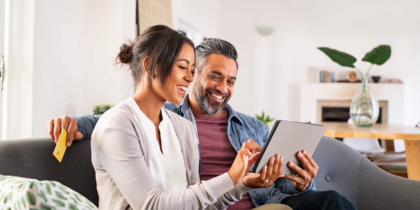 Man and woman making transfer balance online