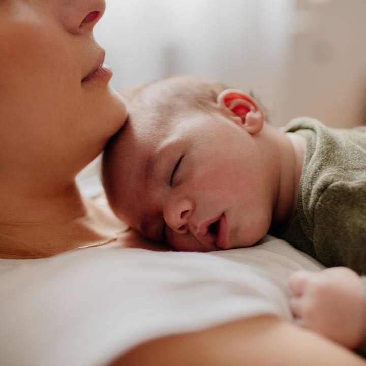 mother resting with baby